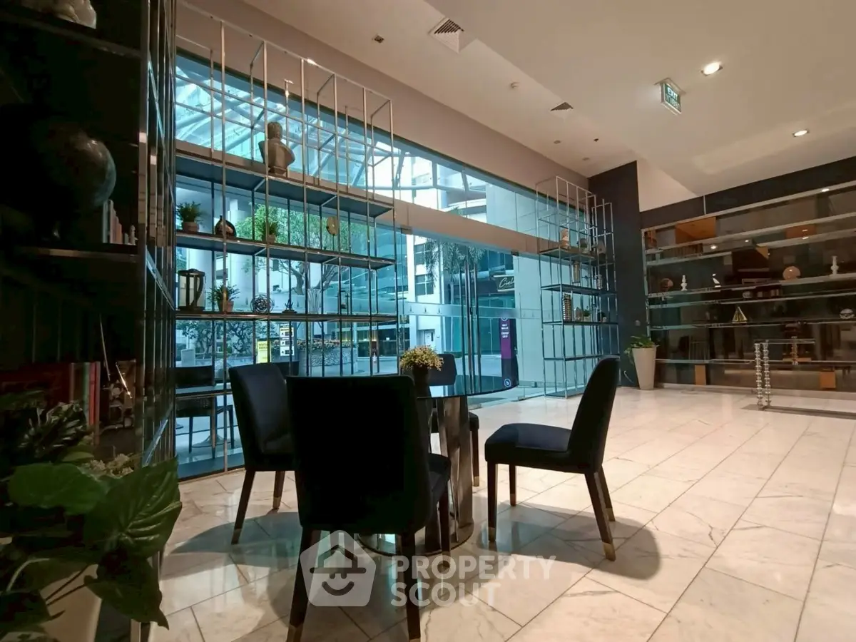 Elegant lobby with modern decor and seating area in a luxurious building