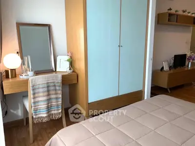 Cozy bedroom with modern furniture and soft lighting, featuring a stylish wardrobe and vanity desk.