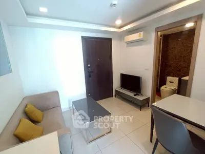 Modern living room with sleek furniture and air conditioning in a cozy apartment.