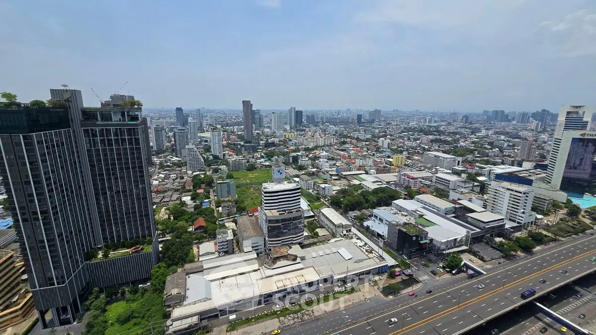 Stunning cityscape view from high-rise building showcasing urban skyline and bustling streets.