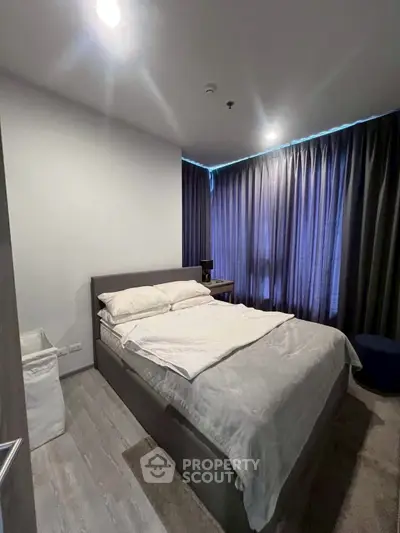 Cozy modern bedroom with stylish decor and natural light