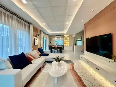 Spacious modern living room with elegant decor and large TV