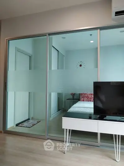 Modern living room with sliding glass doors and stylish decor