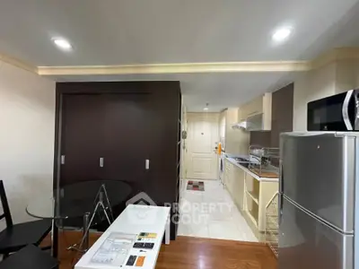 Modern kitchen and dining area with sleek appliances and stylish decor