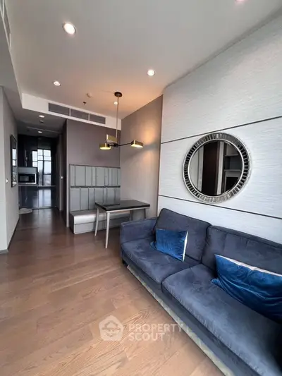 Modern living room with stylish decor and cozy seating in a contemporary apartment.