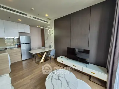Modern living room with stylish furniture and open kitchen layout