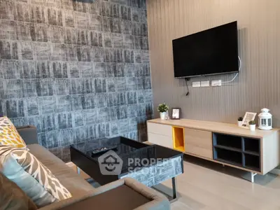 Modern living room with stylish decor and wall-mounted TV
