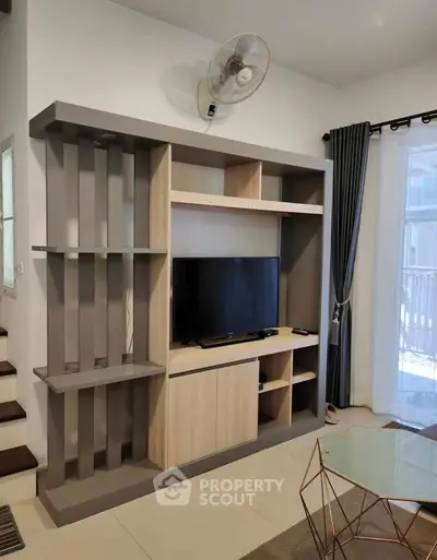 Modern living room with stylish TV unit and contemporary decor