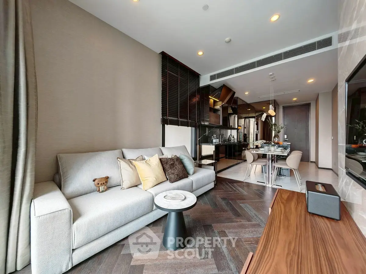 Luxurious modern living room with elegant decor and open kitchen layout, perfect for stylish urban living.