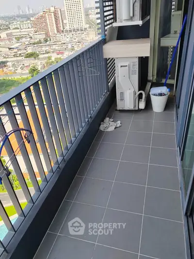 Spacious balcony with city view in modern high-rise apartment