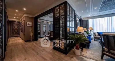 Luxurious living room with elegant decor and spacious layout, featuring stylish furniture and ambient lighting.