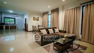 Spacious modern living room with elegant decor and open layout in a luxurious home.
