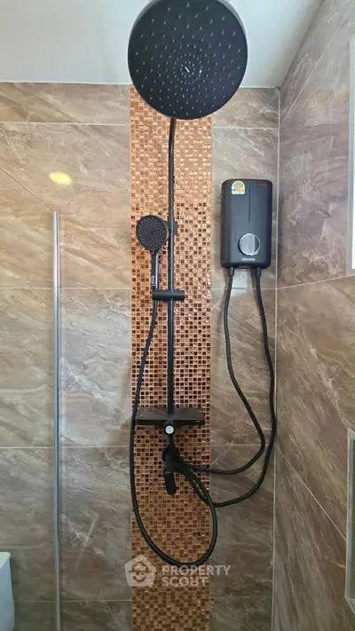 Modern bathroom with rainfall showerhead and water heater, featuring elegant tile design.