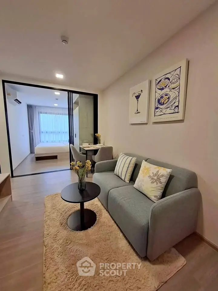 Modern living room with cozy sofa and stylish decor in open-plan apartment