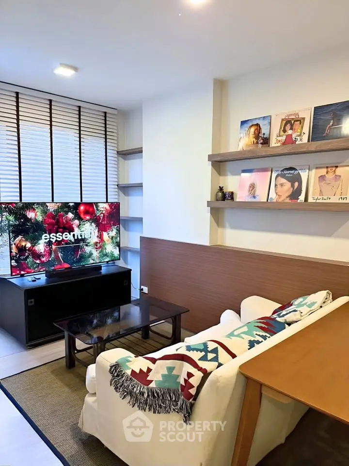 Cozy living room with modern decor and stylish shelving, perfect for relaxation and entertainment.