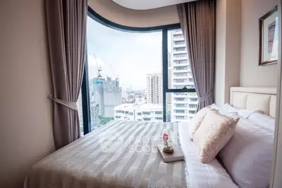 Luxurious bedroom with panoramic city view and elegant decor