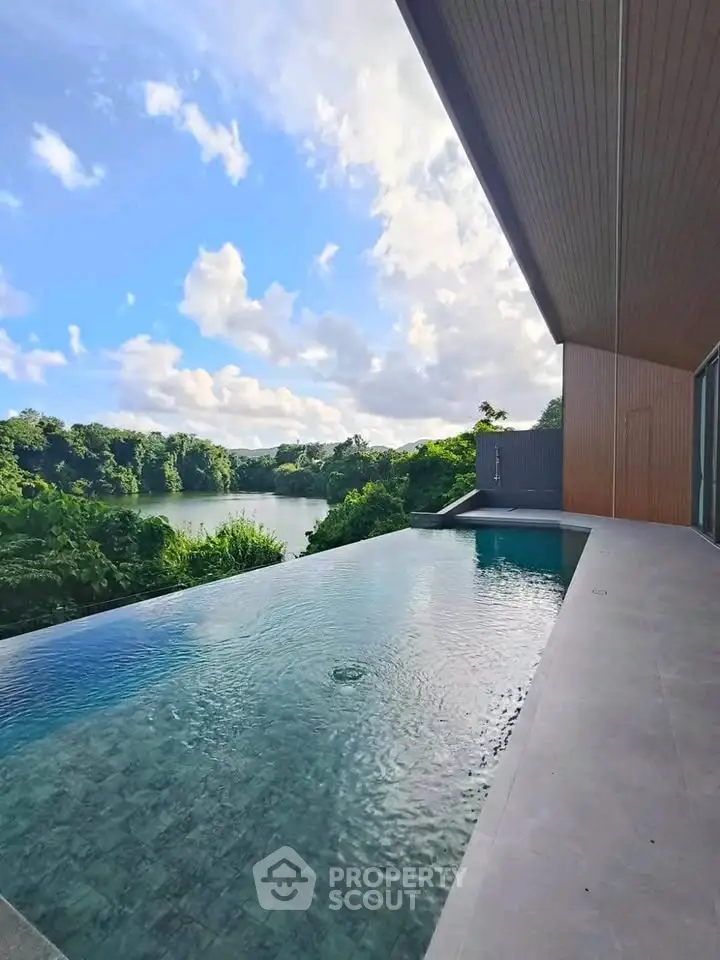 Luxurious infinity pool with stunning nature view, perfect for relaxation and leisure.