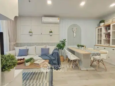 Charming living room with cozy seating and elegant dining area, featuring modern decor and soft lighting.