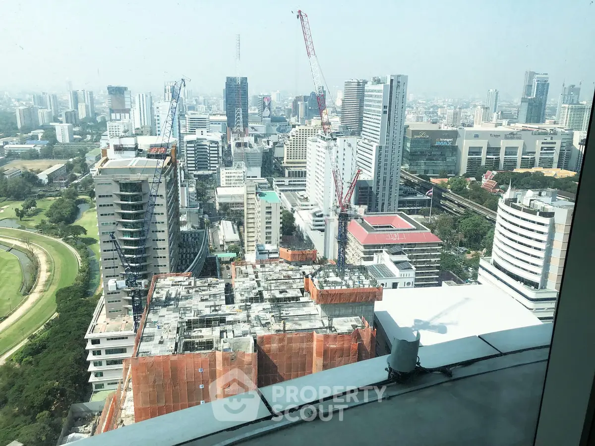 Stunning cityscape view from high-rise building showcasing urban development and skyline.