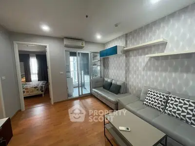 Modern living room with stylish decor and cozy ambiance in a contemporary apartment.
