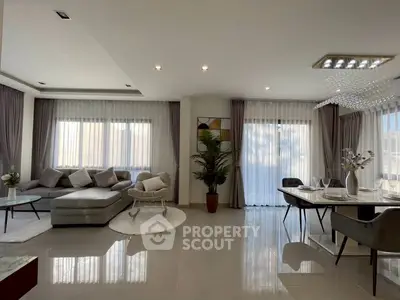 Spacious modern living room with elegant decor and dining area