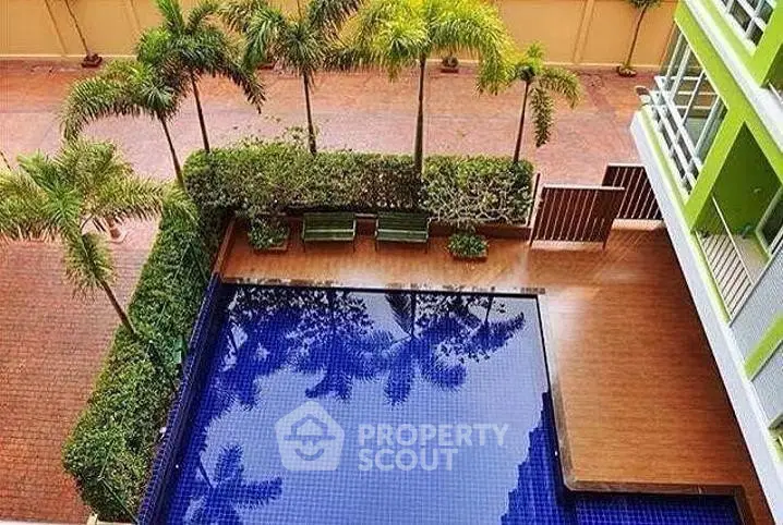 Stunning poolside view with lush greenery and modern design, perfect for relaxation and leisure.