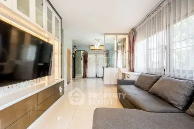 Spacious modern living room with large windows and sleek furniture