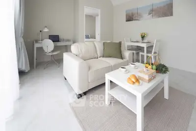 Bright and airy living room with modern decor and cozy seating area, perfect for relaxation.
