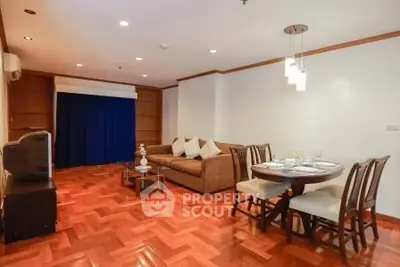 Spacious living room with elegant dining area and cozy seating in modern apartment.