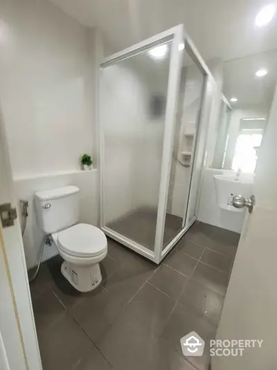 Modern bathroom with sleek shower and contemporary fixtures