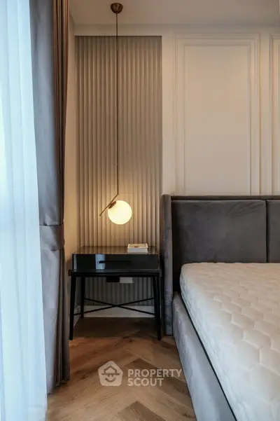 Elegant bedroom corner with modern lighting and stylish decor