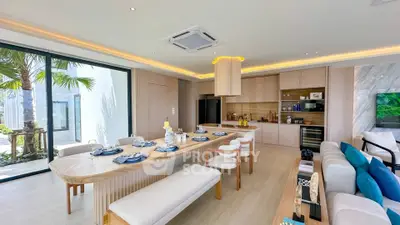 Luxurious open-plan living and dining area with modern kitchen and elegant decor