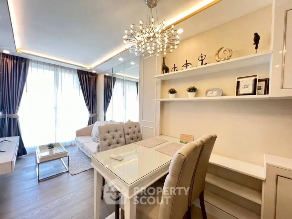 Elegant living room with modern chandelier and stylish decor
