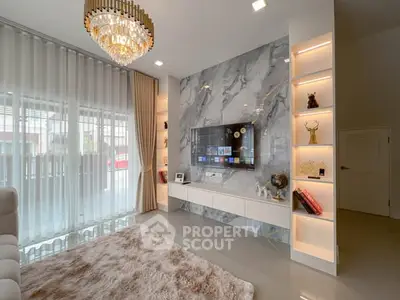 Luxurious living room with marble accent wall and elegant chandelier