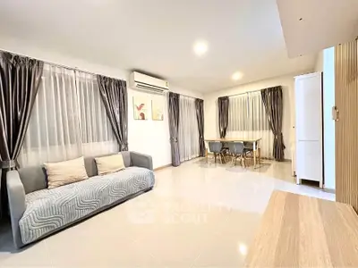 Spacious modern living room with elegant decor and ample natural light