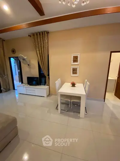 Modern living room with elegant dining area and stylish decor
