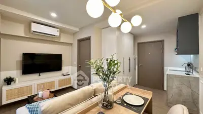 Modern living room with stylish decor and open kitchen layout