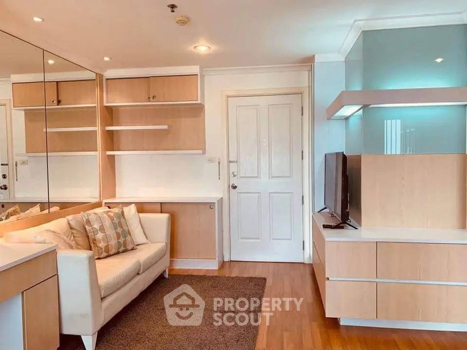 Modern living room with stylish wooden shelves and cozy sofa in a bright apartment.