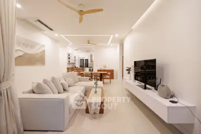 Spacious modern living room with elegant decor and open layout, perfect for family gatherings.