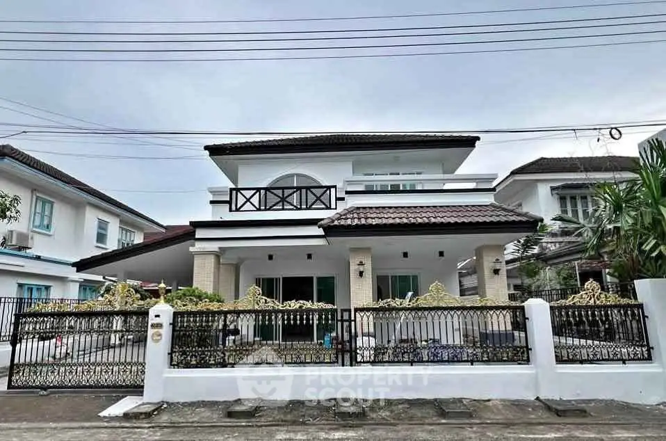 Charming two-story house with spacious balcony and elegant exterior design in a serene neighborhood.