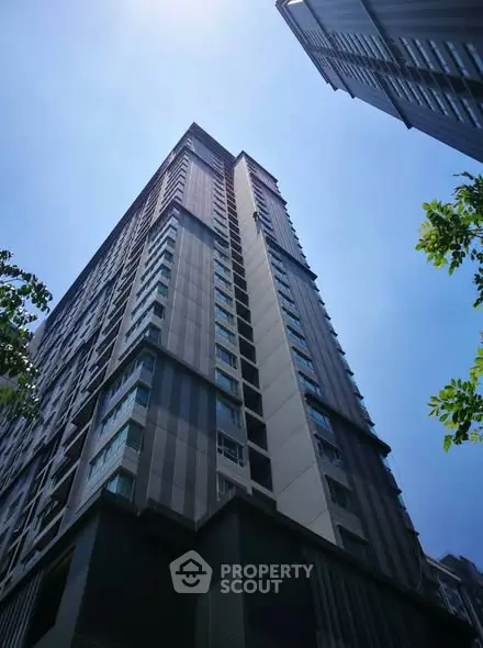 Stunning high-rise building with modern architecture against a clear blue sky.