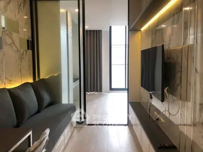 Modern living room with marble accents and sleek TV setup