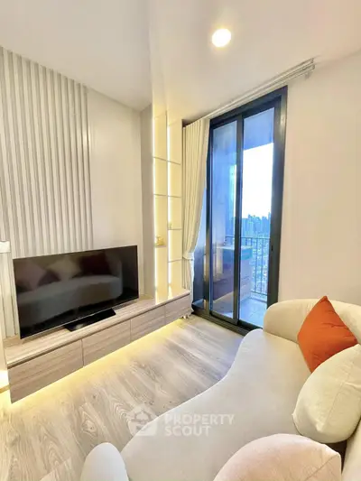Modern living room with sleek TV unit and cozy sofa, featuring a large window with city view.