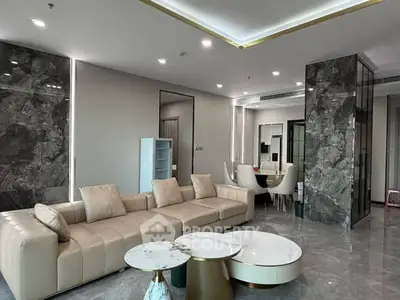 Luxurious modern living room with marble accents and elegant furniture