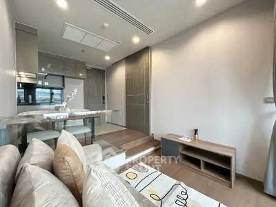 Modern living room with stylish decor and open kitchen layout