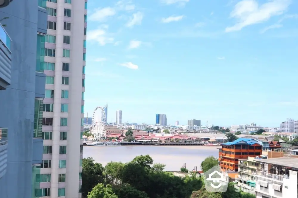 Stunning cityscape view from high-rise apartment balcony overlooking river and skyline.