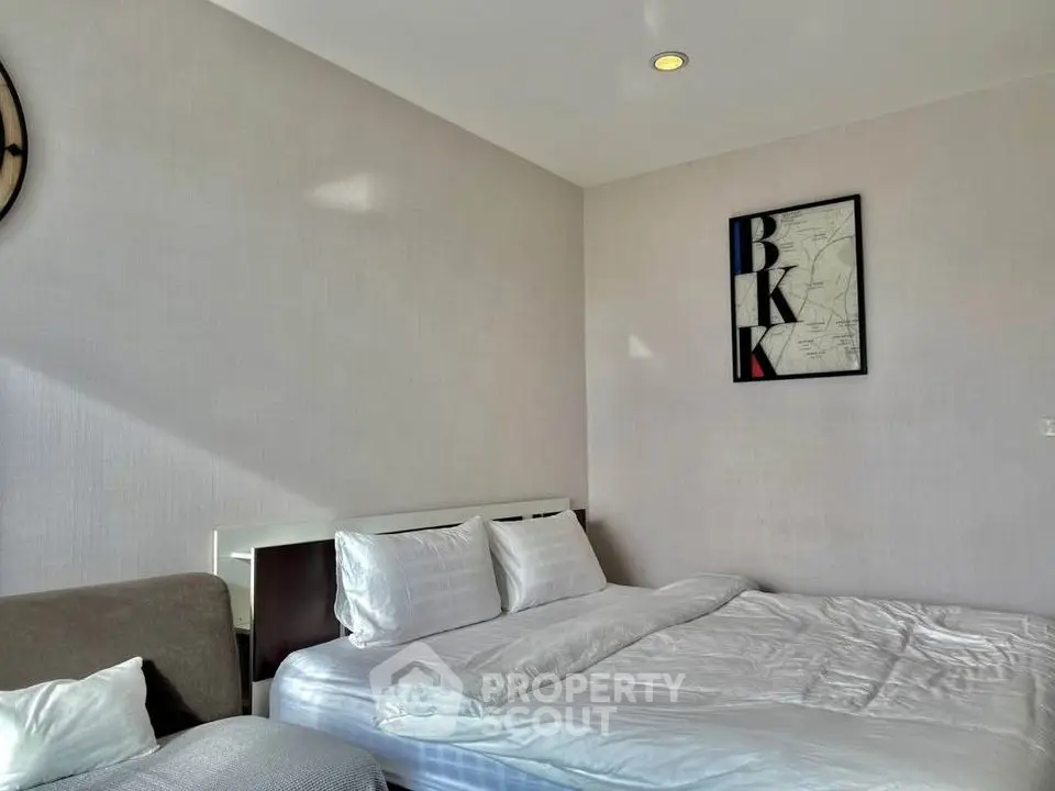 Modern bedroom with stylish decor and comfortable bedding