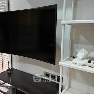 Modern living room with sleek TV and stylish shelving unit