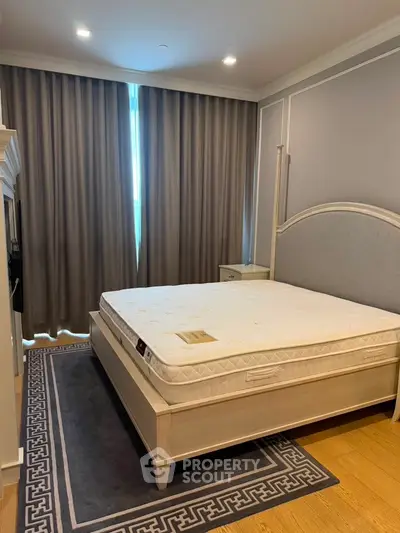 Luxurious bedroom with elegant decor and large bed in modern apartment