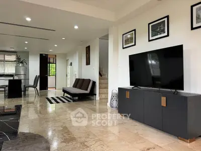 Spacious modern living room with marble flooring and sleek furniture